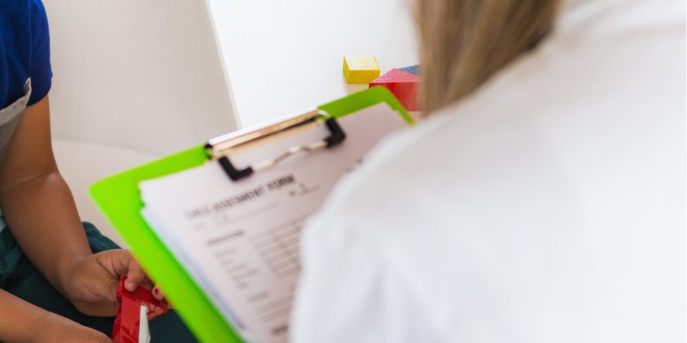 Child psychology, little boy talking to psychologist